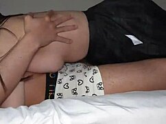 curvy girl in uniform shows legs and tits on bed