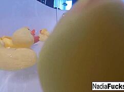 sexy blonde pornstar nadia masturbates her pussy in the bath with rubber duckies!
