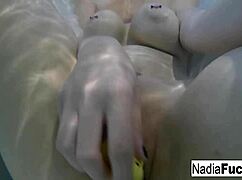 sexy blonde pornstar nadia masturbates her pussy in the bath with rubber duckies!