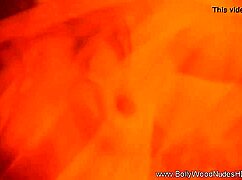 check out this naked brunette striptease, beautiful oriental girl teasing with ripped clothes and exotic music