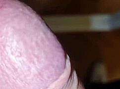The guy with huge cock plays on transparent chair, showing his ass and dick in close-up