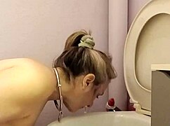 What does the housewife slave do in the toilet?