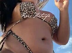 Married prostitute flaunts her juicy big ass on the beach with bikini stuffed inside