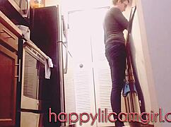 tall girl dominates kitchen cleaning while recording voyeur webcam.