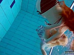 two hot lesbians makin out in the pool underwater