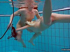 two hot lesbians makin out in the pool underwater