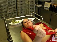 latex slut gets her shaved pussy stuffed with cucumber in the kitchen