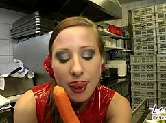 latex slut gets her shaved pussy stuffed with cucumber in the kitchen