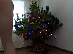 bitch dancing around the christmas tree with ass and pussy