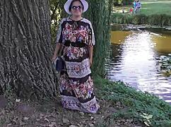 look at that hairy mature flashing her pussy in the park