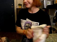 Giving a quick lick and foreplay to her swollen pussy before the party in the kitchen.