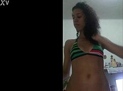 Woman teases in a red bikini at home