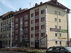 a tourist explores outside eros center amor in frankfurt germany, european adventure.