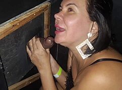 Milf Danni Cardillo sucking at the glory hole and entering the cabin?