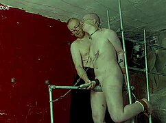 The slave girl, blindfolded and bound, rides the steel pony for domination and multiple orgasms