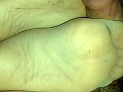 Homemade sensual footjob in tan stockings teasing toes