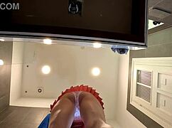 Braless hot brunette skinny and horny babe in a pink mini skirt to show her beautiful ass and legs in the bathroom