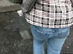 Naughty Jenny gives a blowjob to a dick in a public place, licking and sucking outdoors.