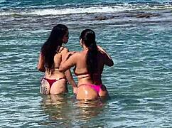 Two gorgeous girls enjoying the beach at enseada dos corais in cabo, pe, with kissing and outdoor fun.