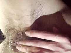 A teacher takes a break to masturbate her hairy wet pussy.