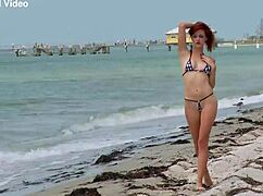 Hollis Ireland showcases her micro bikini in high definition close up