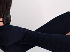 Asian babe in uniform gives footjob with navy socks, dominating slave with beautiful legs