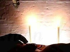 Candlelight glows as she delivers romantic deep blowjob at the party