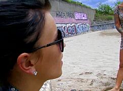 Tattooed short-haired milf feels wild passion riding big cock doggystyle on beach with creampie