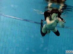Petra's Shaved Teen Pussy Dives Underwater in Pool Tease