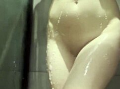 Young Amateur Teases Shaved Pussy in Steamy Shower