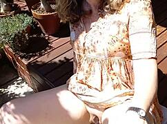 mature blonde cougar wife flashes her huge shaved pussy lips and big vulva while sunning in thong dress homemade exhibitionist spread